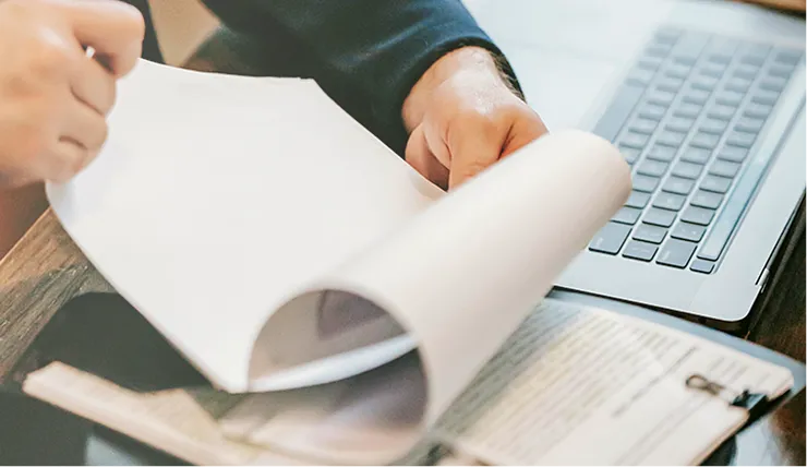 Person going through papers